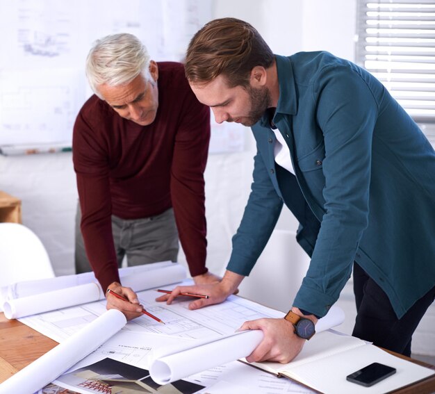 coworker man and blueprint with teamwork at office with pencil for drawing a building design layout and project as architects business people and collaboration on task plan and renovation