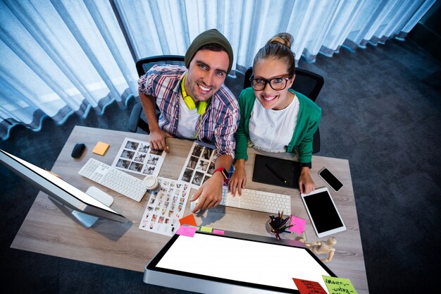 Photo coworkers on computer, top view