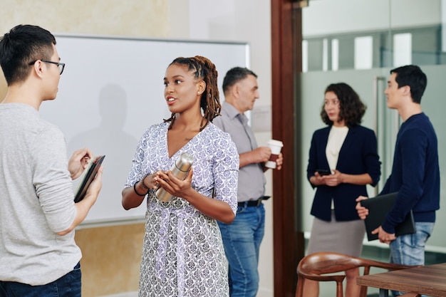 Coworkers talking after meeting