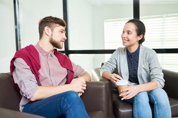 Coworkers talking over coffee