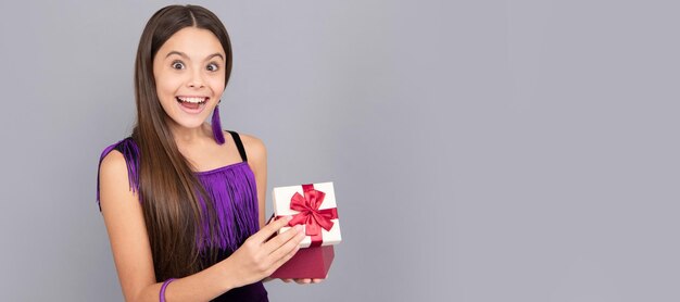 Coz everyone loves surprises surprised girl open present box\
being surprised child with birthday gift horizontal poster banner\
header with copy space