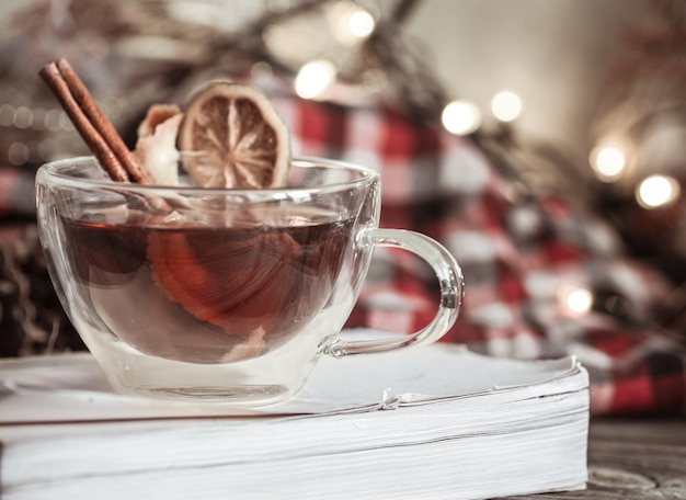 cozy arrangement Christmas Cup with cinnamon and lemon ,the concept of the traditional hot drinks