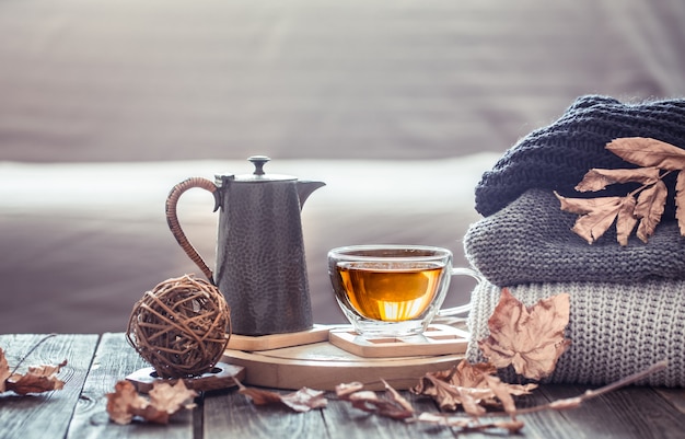 Cozy autumn still life with a cup of tea