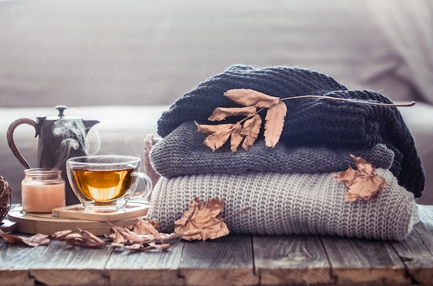 Cozy autumn still life with a cup of tea