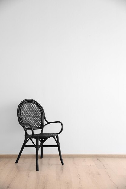 Cozy chair on wall background