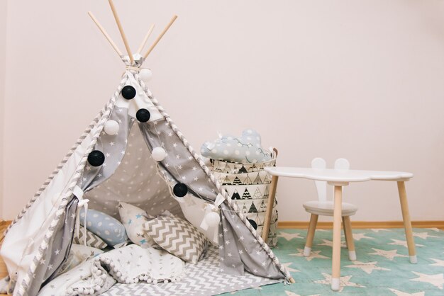 Photo cozy children's room in white, gray and blue colors