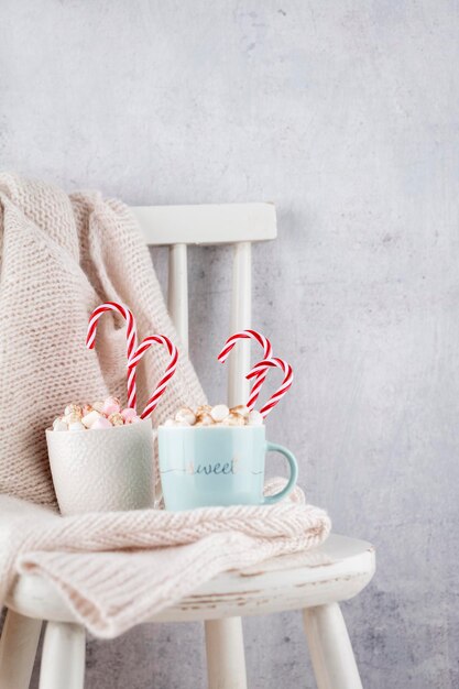 Cozy christmas composition with a cup and cookies. Hot chocolate with marshmallow.