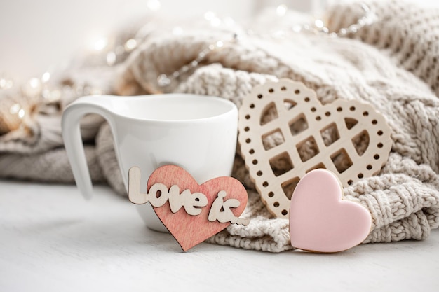 Cozy composition for valentines day with a cup and decor details