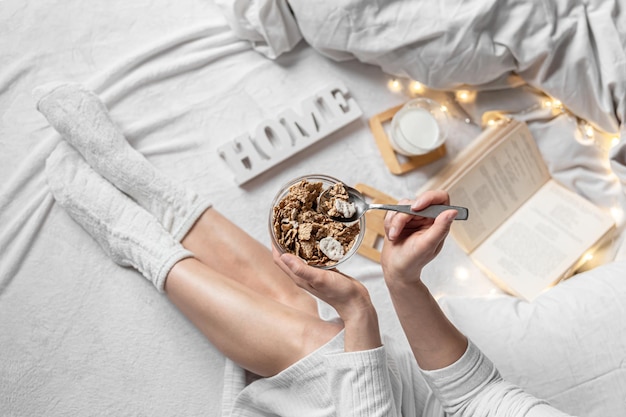 Cozy composition with cereal and milk in bed