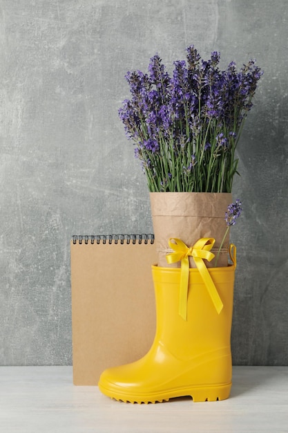 Cozy composition with lavender flowers on wooden table