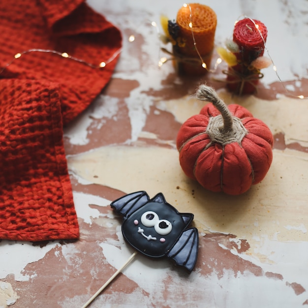 Cozy handmade fabric pumpkins and Halloween gingerbread cookies top view