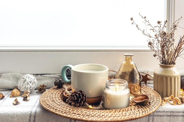 Cozy home composition with coffee cup and home decor details