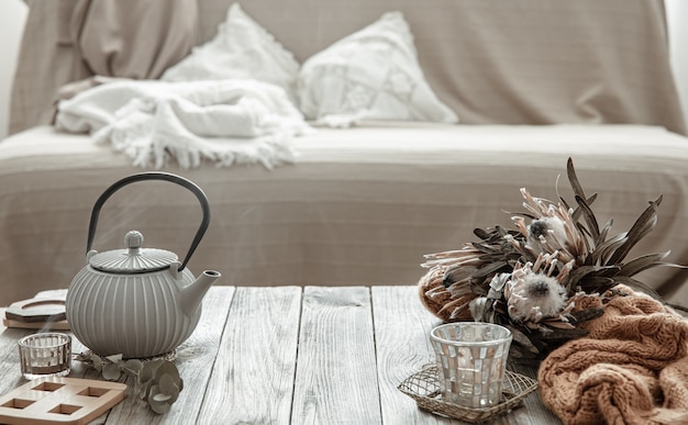 Cozy home composition with a teapot and decor details in the interior of the room