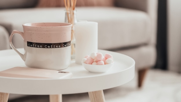 Cozy home decorations in the interior with cup of tea