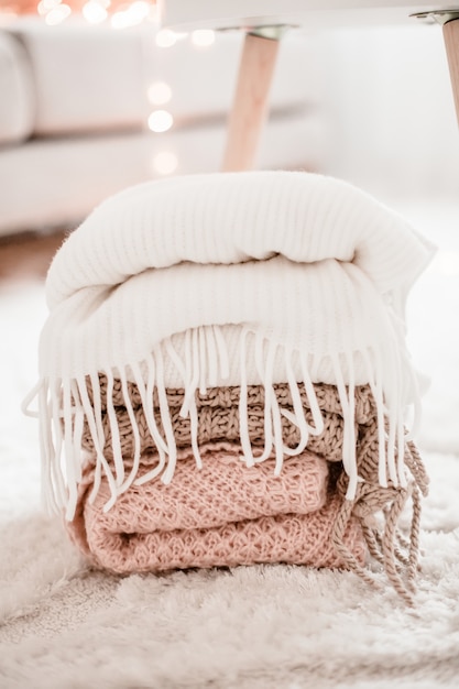 Cozy knitted sweaters in the room