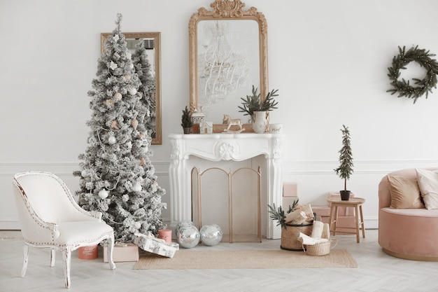 Cozy living room interior with vintage fireplace and decorated christmas tree with presents under it...