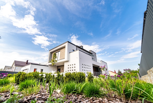 Cozy and modern house with garage and cobblestone driveway. Modern architecture.