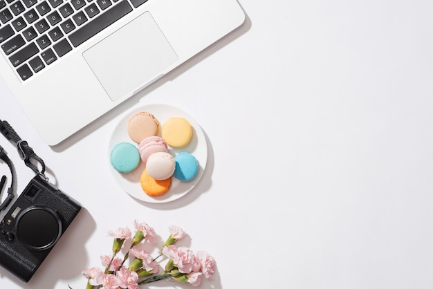 Cozy morning breakfast with pastel colorful macarons or macaroons.