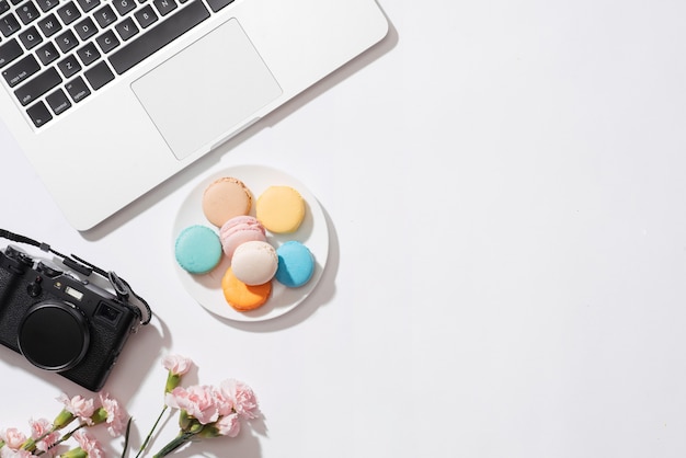 Cozy morning breakfast with pastel colorful macarons or macaroons.