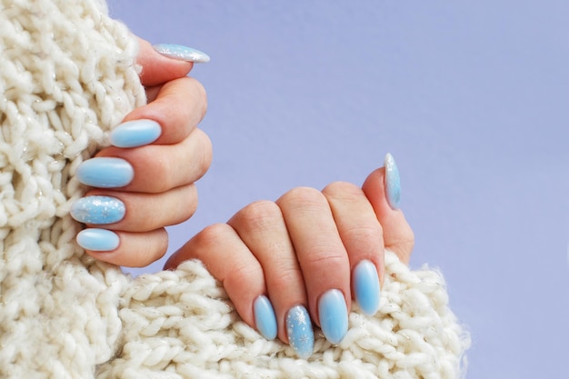 Cozy nails with winter manicure with snowflakes