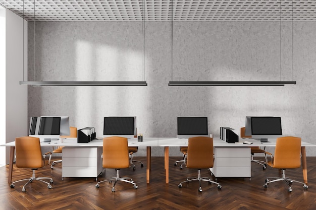 Cozy office interior with pc computer in row armchairs on hardwood floor