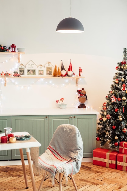 Photo cozy provencal kitchen on new year39s eve with christmas tree gifts and cute christmas decor