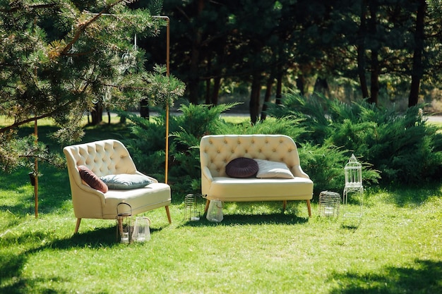 Cozy wicker sofas for relaxing in the garden near the house on the grass Relax and rest