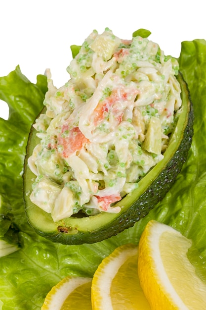 Crab meat salad with green caviar in avocado japan cusine