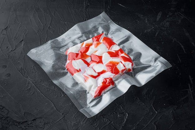 Crab meat surimi vacuum pack set, on black background