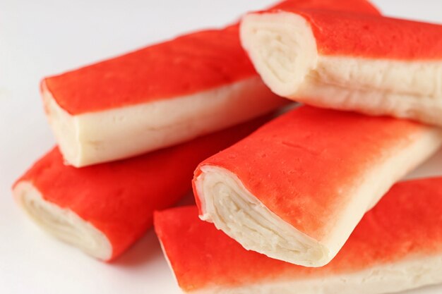 Crab sticks on a white surface
