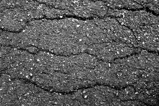 Crack and texture of asphalt road - top view background.