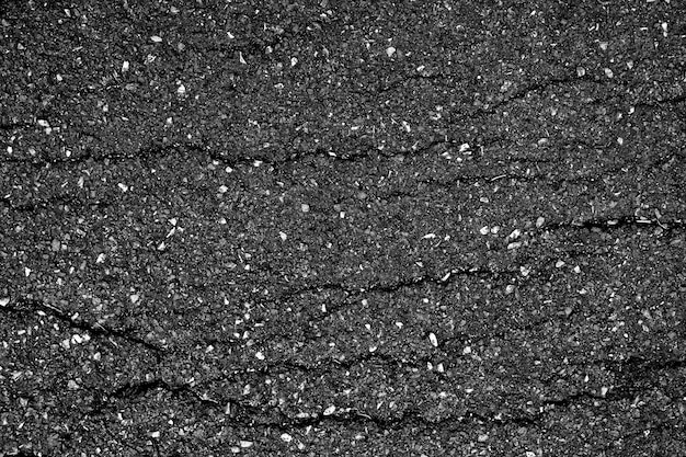 Crack and texture of asphalt road - top view background.