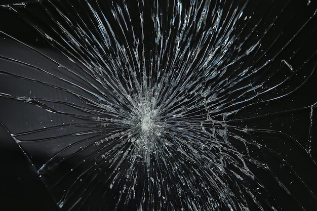 Cracked black glass / broken glass abstract texture\
background