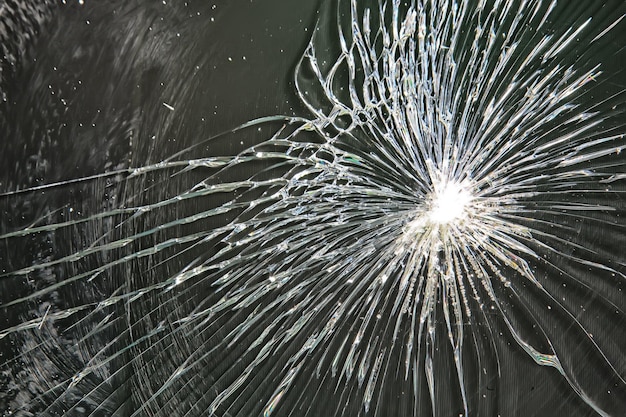 Cracked black glass / broken glass abstract texture\
background