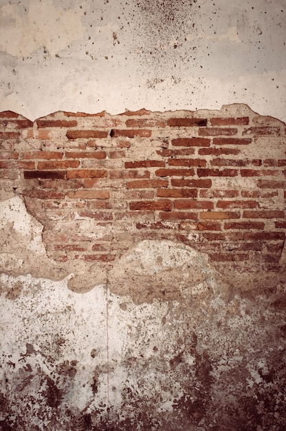 Foto fondo incrinato di struttura del muro di mattoni. effetto vintage