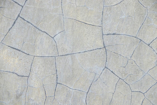 Photo cracked concrete wall in gray