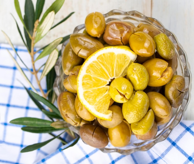 Cracked green olives. Cracked green olives with lemon. Turkish style olive (Turkish name; kirma zeytin)