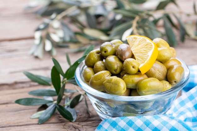 Cracked green olives. Cracked green olives with lemon. Turkish style olive (Turkish name; kirma zeytin)
