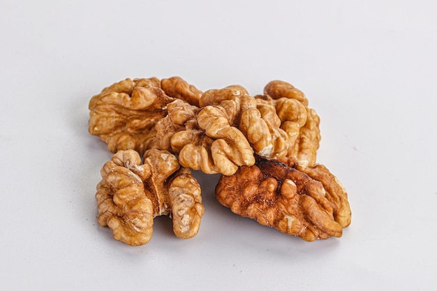 Cracked kernel walnut heap isolated