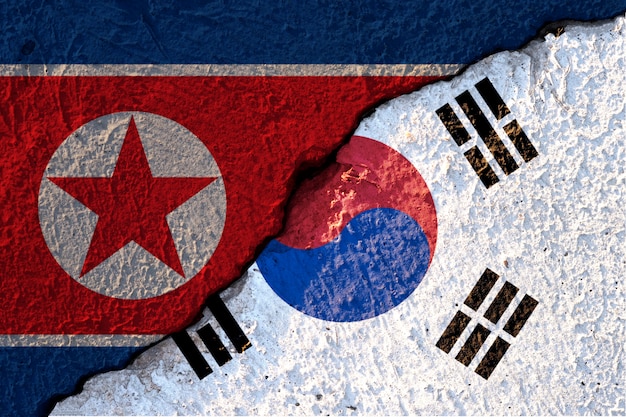 cracked of North Korea flag and South Korea flag 