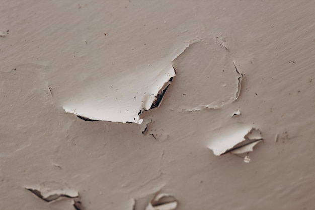 Cracked old plaster on the ceiling closeup