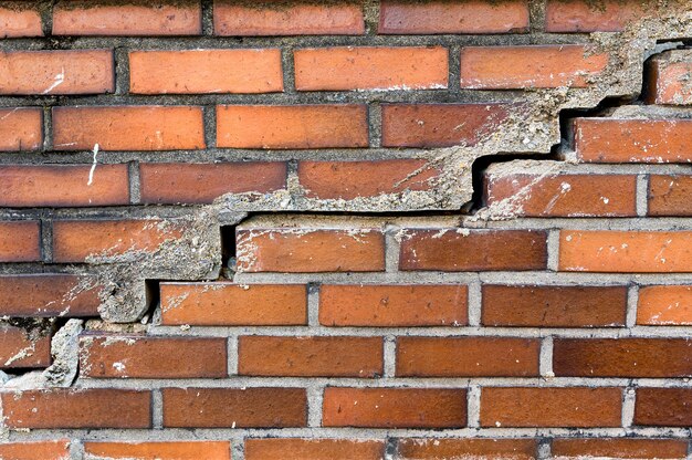 Cracked orange brick wall texture