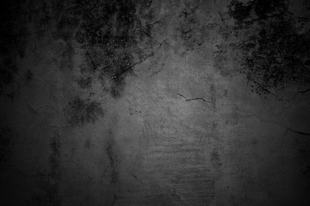 Pareti incrinate il pavimento in cemento grigio scuro è invecchiato in un concetto retrò texture di un muro di cemento nero grungy come sfondo