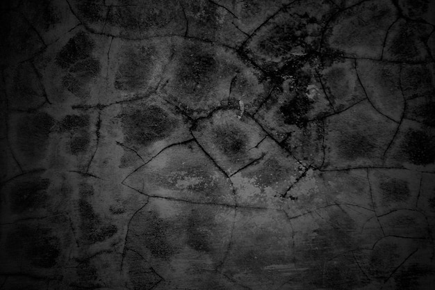 Cracked walls dark gray concrete concrete floor is aged in a retro concept Texture of a grungy black concrete wall as background