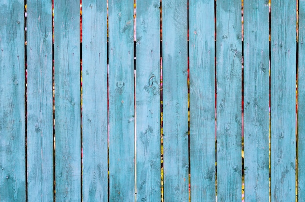 Cracked weathered green and blue painted wooden board texture, front view