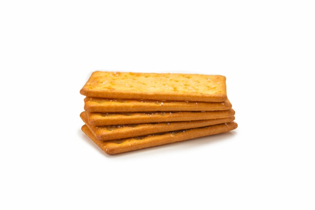 Cracker with salt isolated on white.