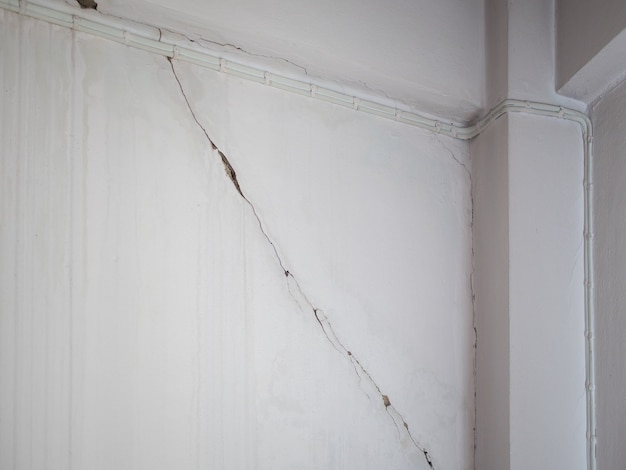 The cracks in the cement walls in the room created problems for water to seep.