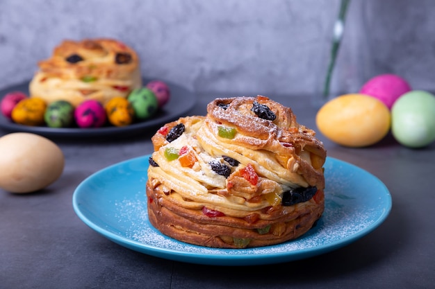 Craffin (Cruffin) with raisins, nuts and candied fruits.