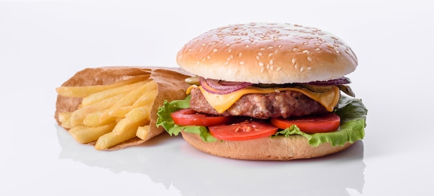 Craft beef burger and french fries on a white background