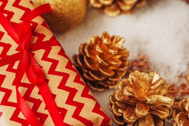 Craft gift boxes over snowy wooden table close up